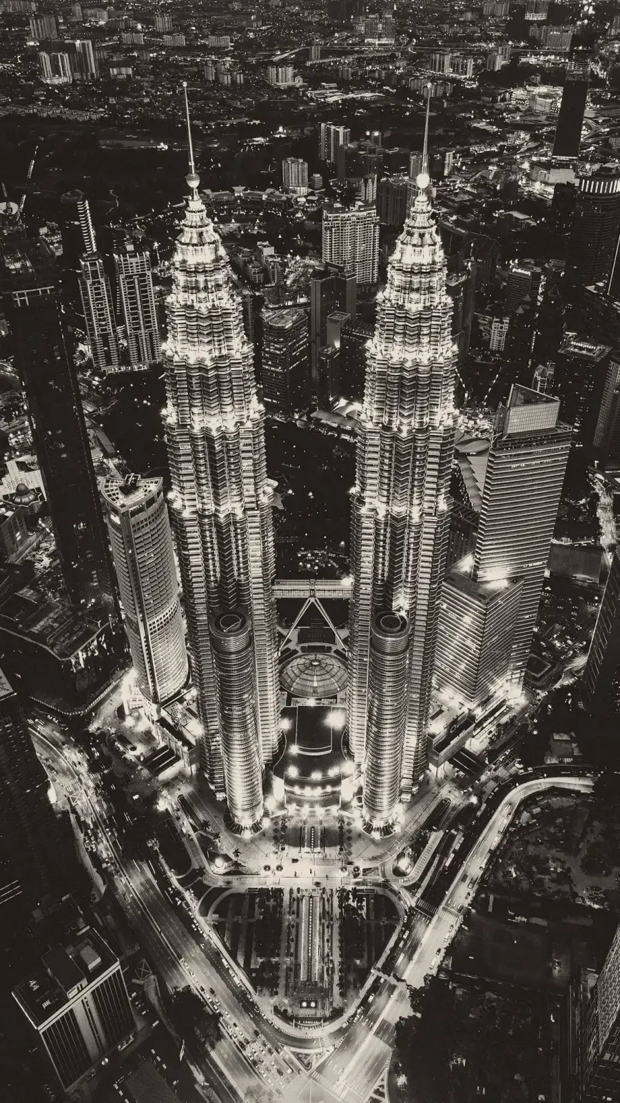Aerial view of the Petronas Towers and central Kuala Lumpur at night